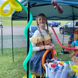 a person dressed as a scarecrow