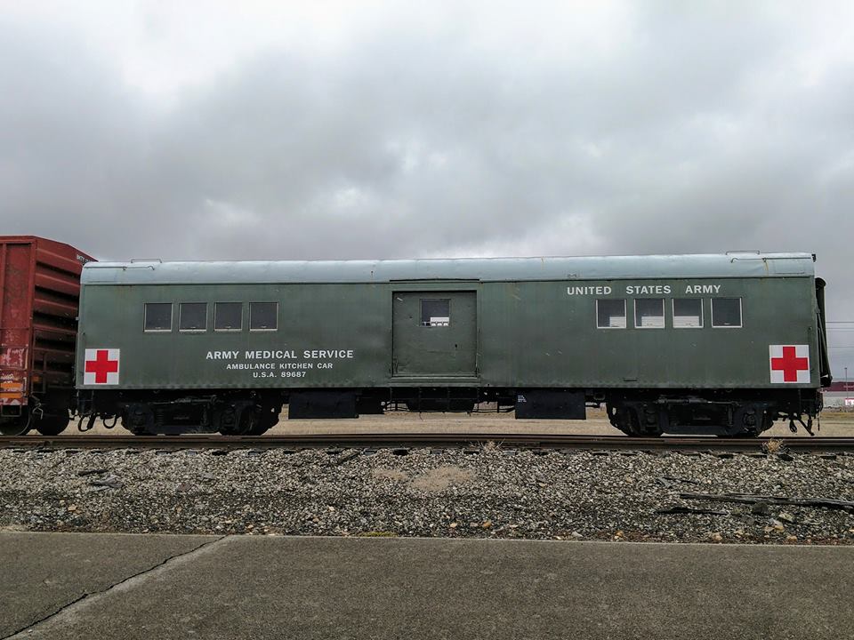 QUEEN CITY TAVERN – 1379 EX-US ARMY a large long train on a steel track