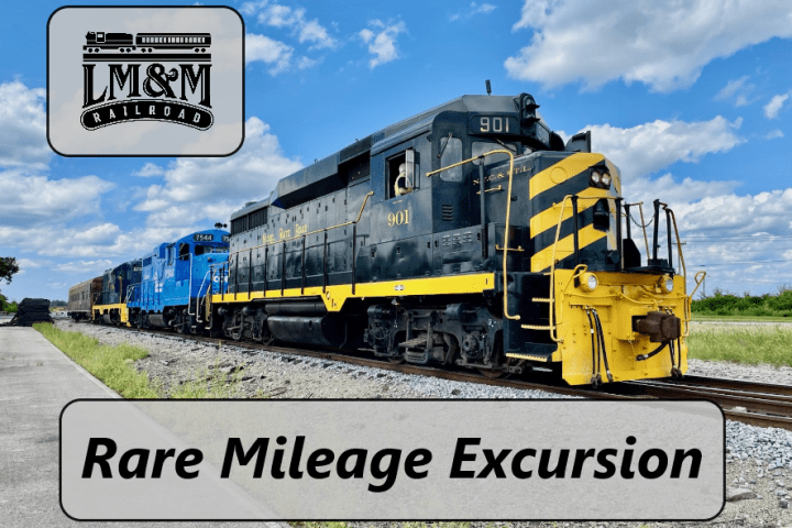 Black and blue trains on track under blue sky with LM&M Railroad logo and 'Rare Mileage Excursion' text.